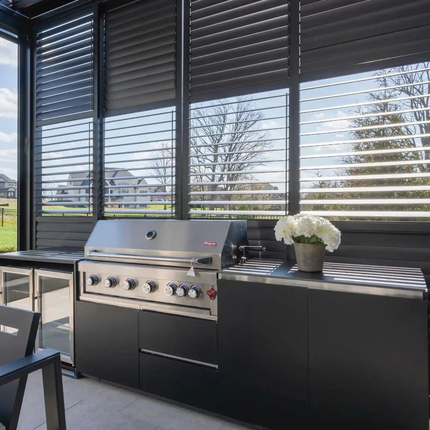 sliding shutter outdoor kitchen